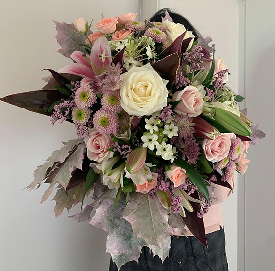 Jo Hammonds, Oadby florist, Wigston florist, Market Harborough Florist, Leicester Florist, with a Luxury, contemporary luxury pink handtied bouquet, with pink roses, pink foliage & other flowers for LCFC player Jamie Vardy