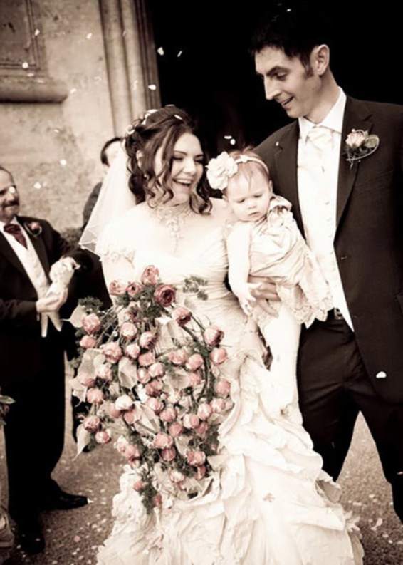 Oadby Florist, Wigston Florist, Leicester wedding flowers, Belvoir Castle wedding flowers, couple holding baby, confetti
