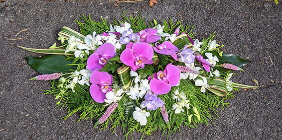 Oadby Funeral Flowers, Wigston Funeral flowers, Leicester funeral flowers, Purple and white orchid Casket spray