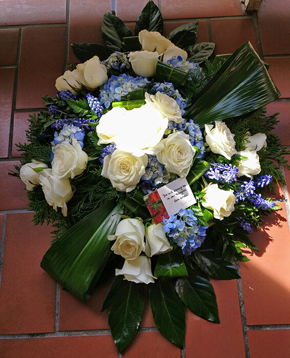 Oadby Funeral Flowers, Wigston Funeral Flowers, Market Harborough Funeral Flowers, Posy Tribute, Large posy arrangement with white & blue flowers with strnag greenery, contemporary style