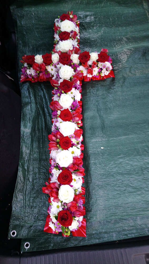 Oadby funeral flowers, Wigston funeral flowers, Cross tribute with Red & White flowers