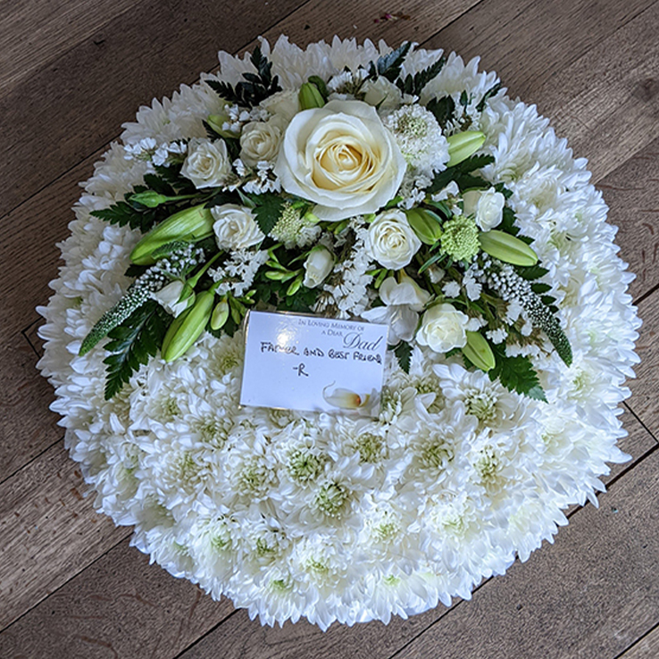 Market Harborough Funeral Flowers,Traditional stlye, Round posy arrangement with white base flowers & white & green spray.