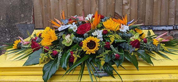 Oadby Funeral Flowers, Wigston Funeral Flowers, Leicester funeral flowers, bird of paradise, sunflower & red rose casket spray
