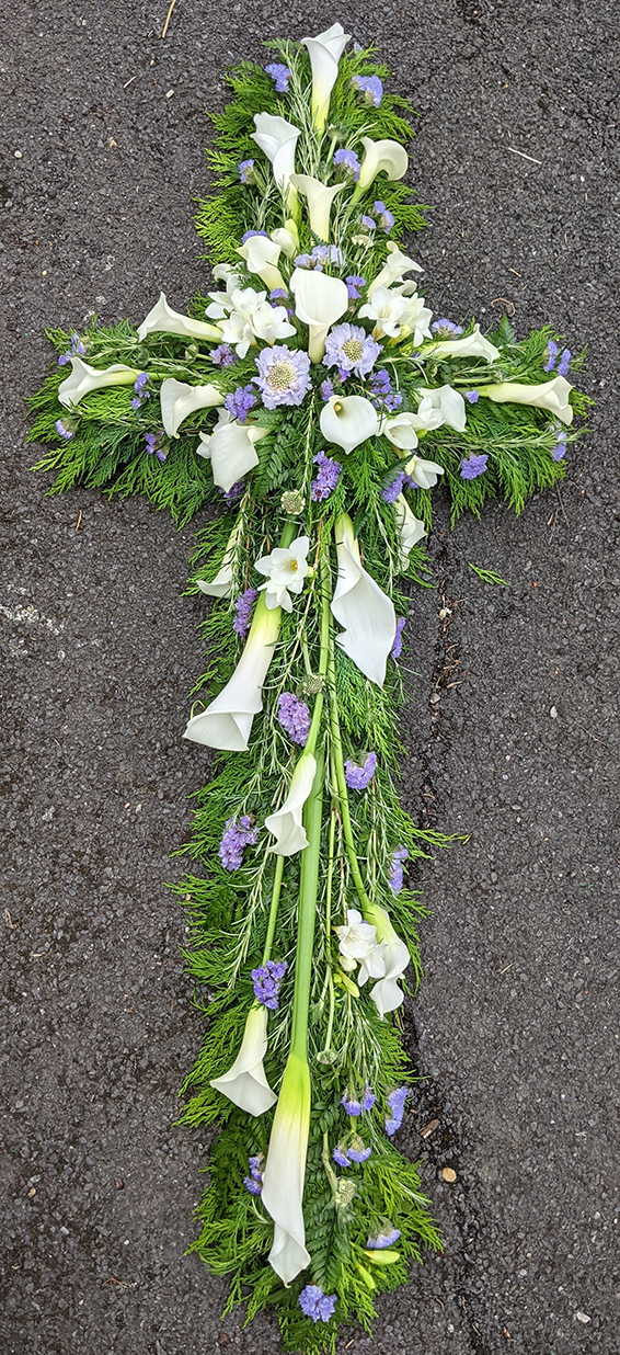 Oadby funeral flowers, Wigston funeral flowers, Sooth Pastel Shades Cross Tribute with Calla lilies & Scabious.