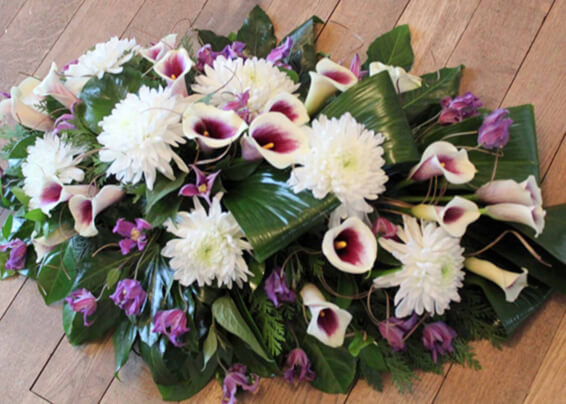 Oadby florist, Wigston florist, Leicester funeral flowers, Contemporary Casket spray with purple calla lilies.