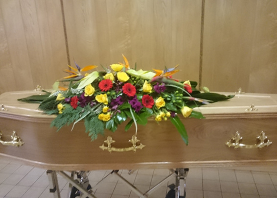 Oadby florist, Wigston Florist, Leicester funeral flowers, funeral spray on a casket, exotic flowers including stralitzia, calla lilies, anthuriums etc.