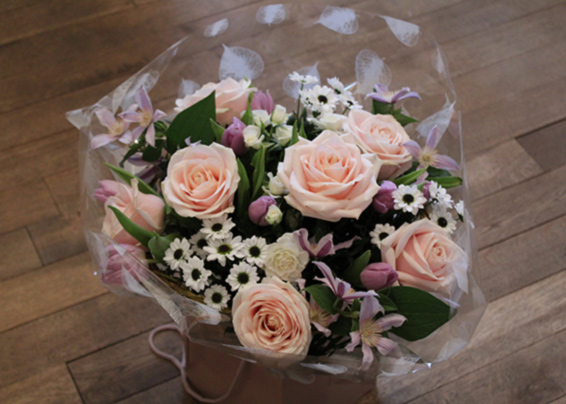 Oadby florist, Wigston florist, Pink avalanche roses, white spray chrysanthemums, lilac clematis, handtied bouquet
