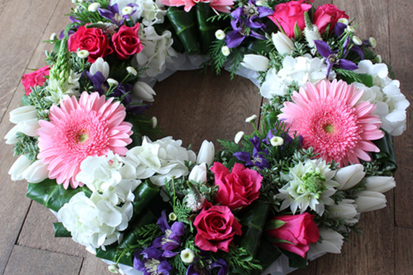 Oadby florist, Wigston florist, funeral flowers, Pink, blue and white sympathy wreath