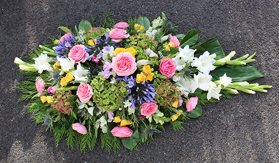 Oadby Funeral Flowers, Wigston Funeral flowers, Leicester funeral flowers, Pink, white and green, garden style Casket spray
