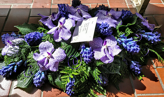 Oadby Funeral Flowers, Wigston Funeral flowers, Purple orchid and hyacinth fragrant Casket spray