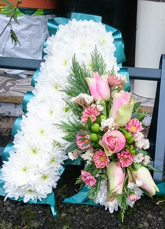 Oadby Funeral flowers, Wigston Funeral Flowers, Letter A tribute, with green ribbon edge.