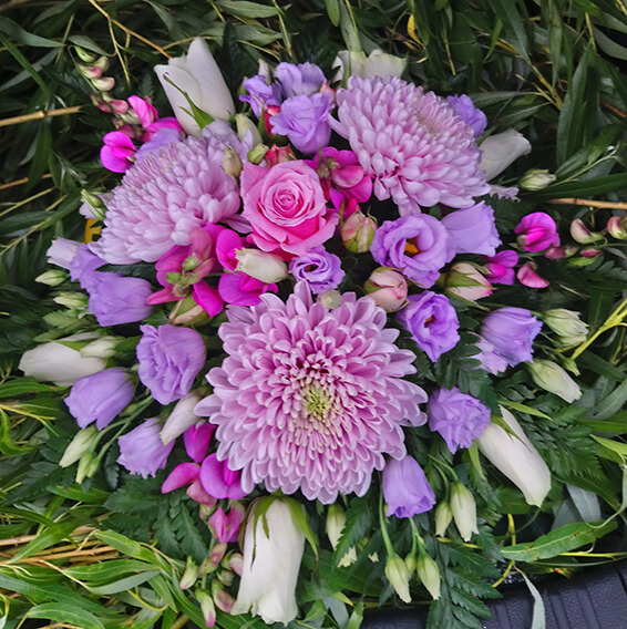 Oadby Funeral Flowers, Wigston Funeral Flowers, Market Harborough Funeral Flowers, Posy Tribute, Tradional posy arrangement in pink and purple flowers