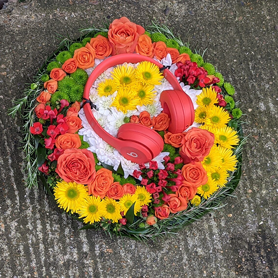 Oadby funeral flowers, Wigston funeral flowers, Market Harborough Funeral Flowers, Leicester Funeral Flowers, Bespoke Personal posy tribute with Beats headphones, colourful
