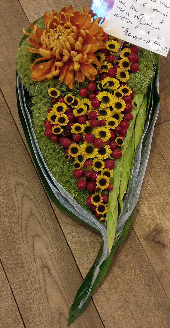 Oadby funeral flowers, Wigston funeral flowers, teardrop tribute, autumn colours with berries.