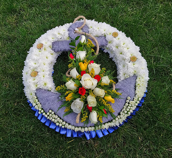 Oadby funeral flowers, Wigston funeral flowers, Market Harborough Funeral Flowers, Anchor Tribute with lifebuoy wreath ring made in flowers
