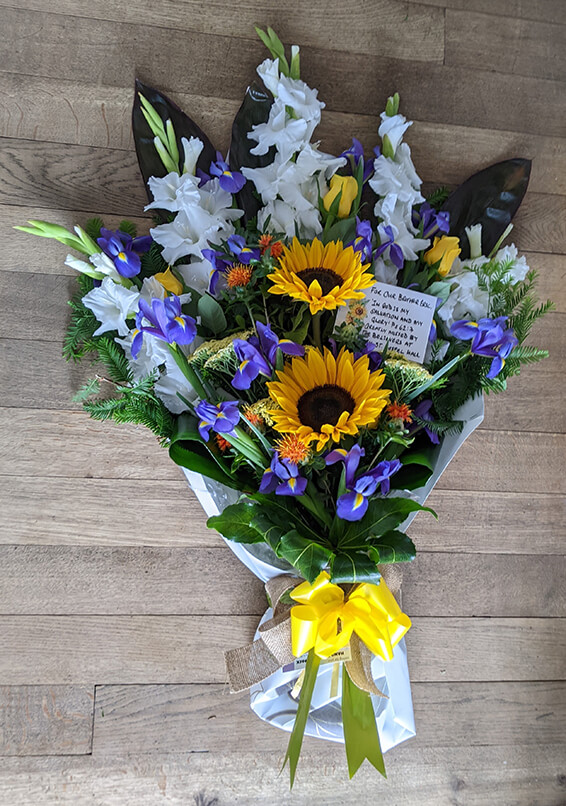 Oadby Funeral Flowers, Wigston Funeral Flowers, Tied Sheaf Tribute with sunflowers and iris
