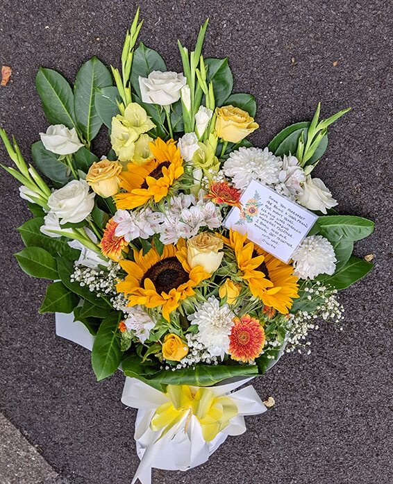 Oadby Funeral Flowers, Wigston Funeral Flowers, Market Harborough Funeral Flowers, Tied Sheaf Tribute with sunflowers & white flowers