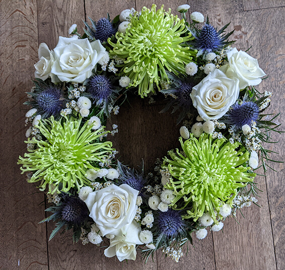 Oadby Funeral Flowers, Wigston Funeral Flowers, Wreath ring Sympathy Tribute, lime white blue flowers