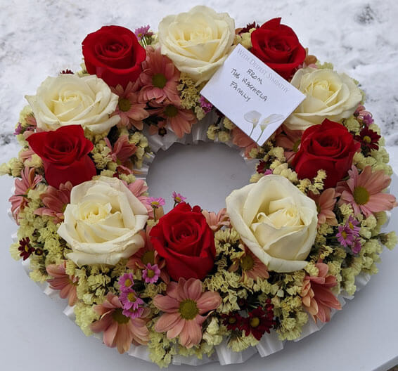Oadby Funeral Flowers, Wigston Funeral Flowers, Wreath ring Sympathy Tribute, white roses and pastels
