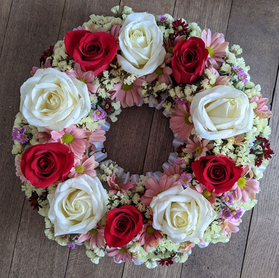 Oadby Funeral Flowers, Wigston Funeral Flowers, Market Harborough Funeral Flowers, Wreath ring Sympathy Tribute, white rose and pastels