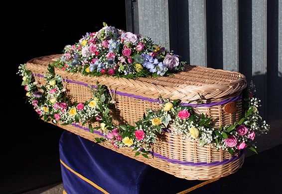 Oadby Funeral Flowers, Wigston Funeral flowers, Market Harborough Funeral Flowers, Leicester funeral flowers, Very pretty, Luxury swagged garland, with rosemary, ivy  & mixed greenery, hot pink and lemon spray roses