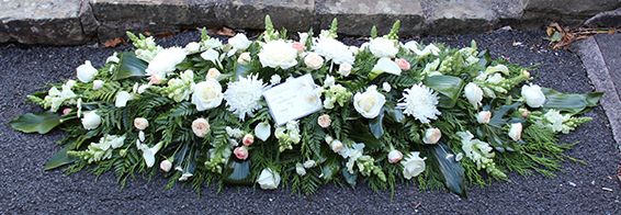 Oadby Funeral Flowers, Wigston Funeral Flowers, Leicester funeral flowers, White and peach flowers 4ft casket spray