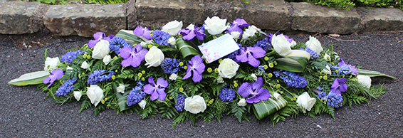 Oadby Funeral Flowers, Wigston Funeral Flowers, Leicester funeral flowers, Blue orchid,blue hyacinth & white rose casket spray
