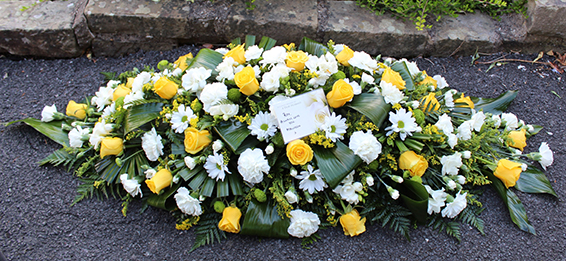 Oadby Funeral Flowers, Wigston Funeral Flowers, Leicester funeral flowers, yellow rose, white carnation 4ft casket spray