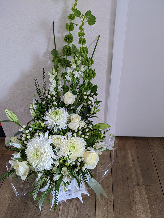 Oadby Funeral Flowers, Wigston Funeral Flowers, Market Harborough Funeral Flowers, Condolence Flower Basket, with predominantly white, lilac & lime green flowers with supporting greenery