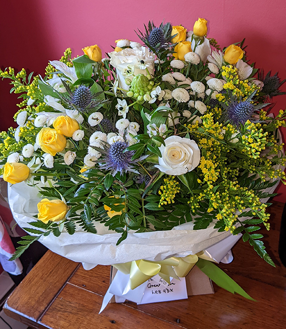 Oadby Funeral Flowers, Wigston Funeral Flowers, Market Harborough Funeral Flowers, Condolence Flower Bouquet, with beautiful yellow, white & blue flowers.
