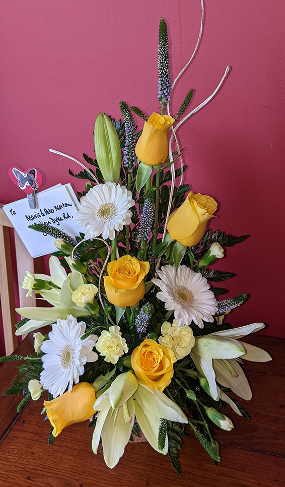 Oadby Funeral Flowers, Wigston Funeral Flowers, Market Harborough Funeral Flowers, Condolence Flower Arrangement, vertical design, with yellow roses, veronica, gerbera & lilies.