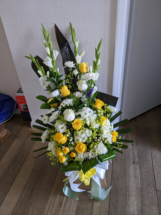 Oadby Funeral Flowers, Wigston Funeral Flowers, Market Harborough Funeral Flowers, Condolence Bouquet, Round handtied bouquet, with yellow & white mixed flowers with supporting greenery