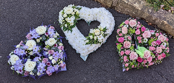 Oadby Funeral Flowers, Wigston Funeral Flowers, Market Harborough Funeral Flowers, Leicester Funeral Flowers, Three different Open Heart Tributes, lilac, white & pink, white heart is based anf traditional style