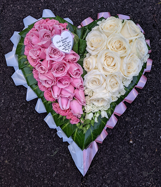 Oadby Funeral Flowers, Wigston Funeral Flowers, Market Harborough Funeral Flowers, Leicester Funeral Flowers, Contemporary Broken Heart Tribute with half pink roses and half white roses surrounded by greenery & ribbons 