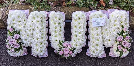 Oadby Funeral flowers, Wigston Funeral Flowers, Market Harborough Funeral Flowers, Leicester Funeral Flowers, MUM tribute, traditional style with white base & baby pink sprays & ribbons
