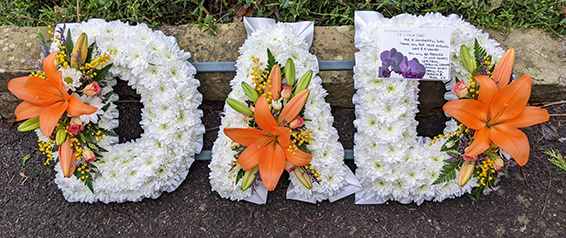 Oadby Funeral flowers, Wigston Funeral Flowers, Market Harborough Funeral Flowers, Leicester Funeral Flowers, DAD tribute, traditional style with orange lily spray