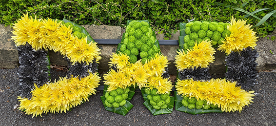 Oadby Funeral flowers, Wigston Funeral Flowers, Market Harborough Funeral Flowers, Leicester Funeral Flowers, DAD tribute, Jamaican flag colours, contemporary style