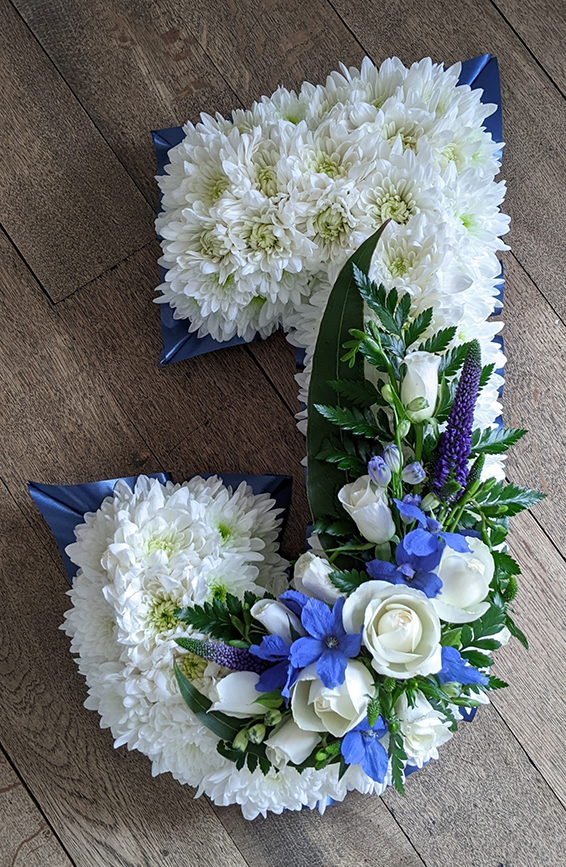 Oadby Funeral flowers, Wigston Funeral Flowers, Market Harborough Funeral Flowers, Leicester Funeral Flowers, Letter J, tradtional style, white base with blue & white spray & ribbons