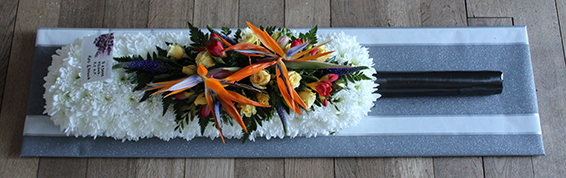 Oadby funeral flowers, Wigston funeral flowers, Market Harborough Funeral Flowers, Cricket bat funeral tribute with tropical flower spray