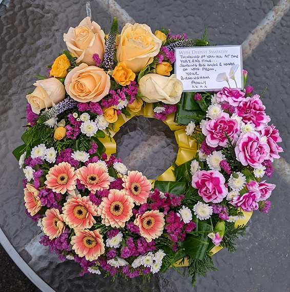 Oadby Funeral Flowers, Wigston Funeral Flowers, Market Harborough Funeral Flowers, Contemporary Wreath ring with groups of colourful flowers