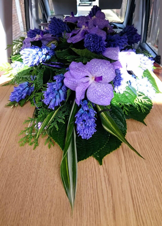 Oadby florist, Wigston florist, Leicester funeral flowers, Purple vanda orchids funeral spray with casket