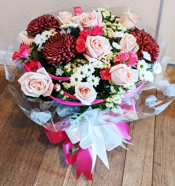 Oadby florist, Wigston florist, Pale pink roses,pink and red flowers, round handtied bouquet