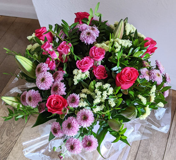 Oadby florist, Wigston florist, Pink and cream seasonal flower with lily, round handtied bouquet