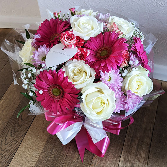 Oadby florist, Wigston florist, Hot pink gerbera and white roses, round handtied bouquet
