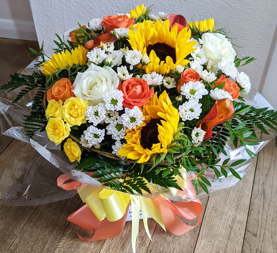 Oadby florist, Wigston florist, White and orange roses with sunflowers, round handtied bouquet
