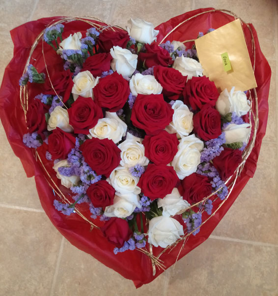 Oadby florist, Wigston florist, Heart shaped bouquet with red and white roses, re tissue paper wrap