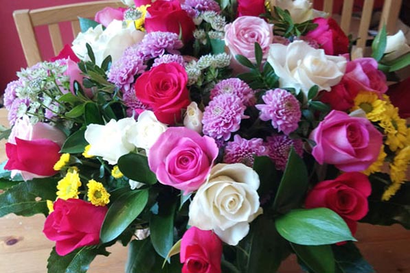 Oadby florist, Wigston Florist, Seasonal handtied bouquet, gold bloom chrysanthemums, ranunculus, roses, september flowers