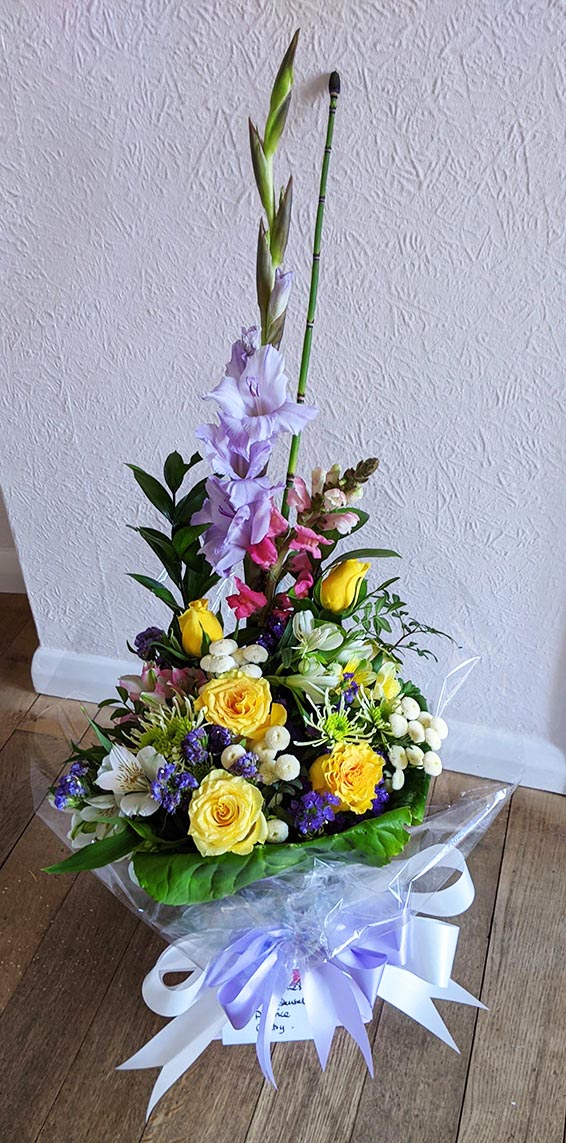 Oadby florist, Wigston florist, Yellow rose, pink snapdragon and lilac mixed flower, vertical handtied bouquet