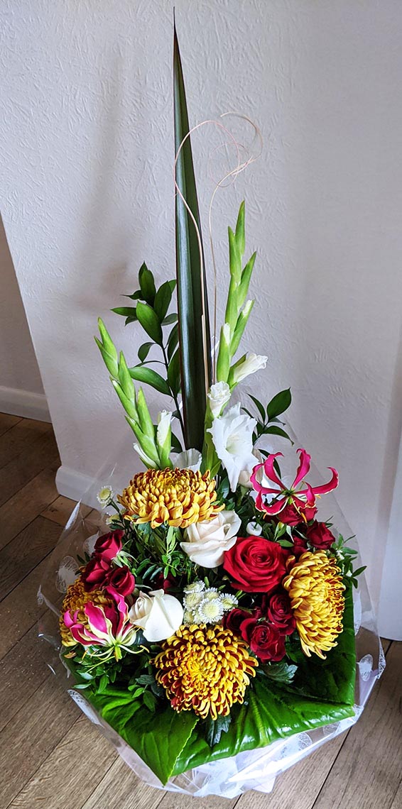 Oadby florist, Wigston florist, Autumnal mixed seasonal flowers, tropical gloriosa, vertical handtied bouquet