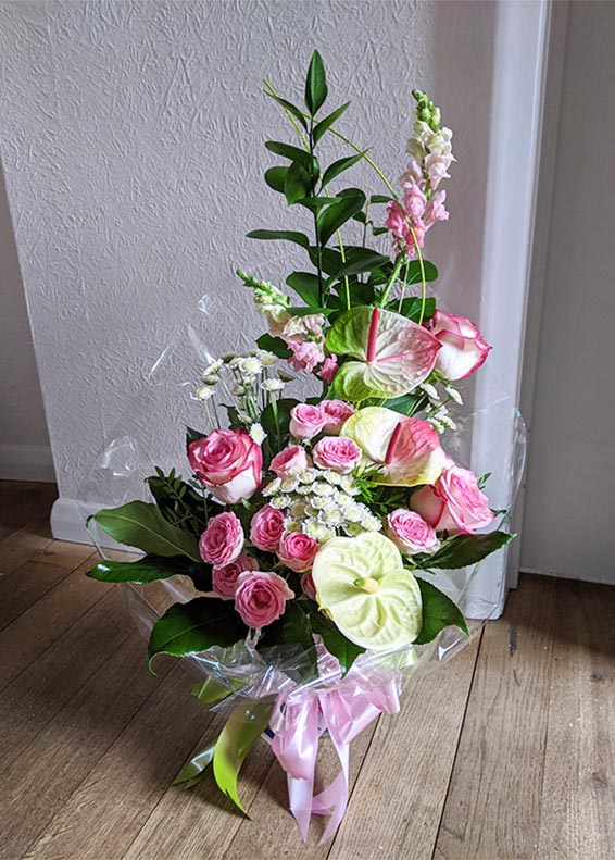 Oadby florist, Wigston florist, pink vertical bouquet, roses and lime anthuriums